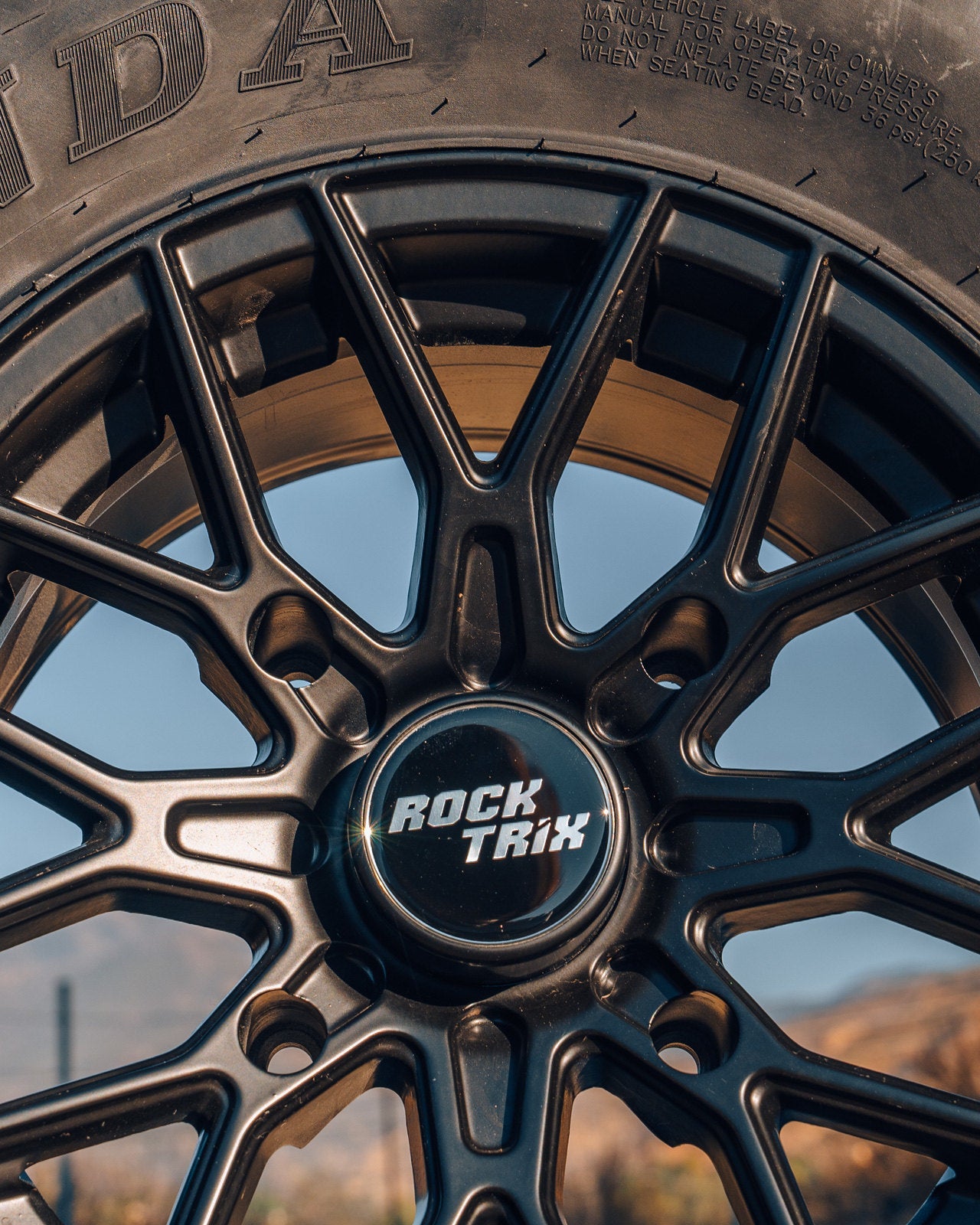 RT104 - 14x7 (ET10) 4x156 131 Black + 30x10R14 Tire (Single